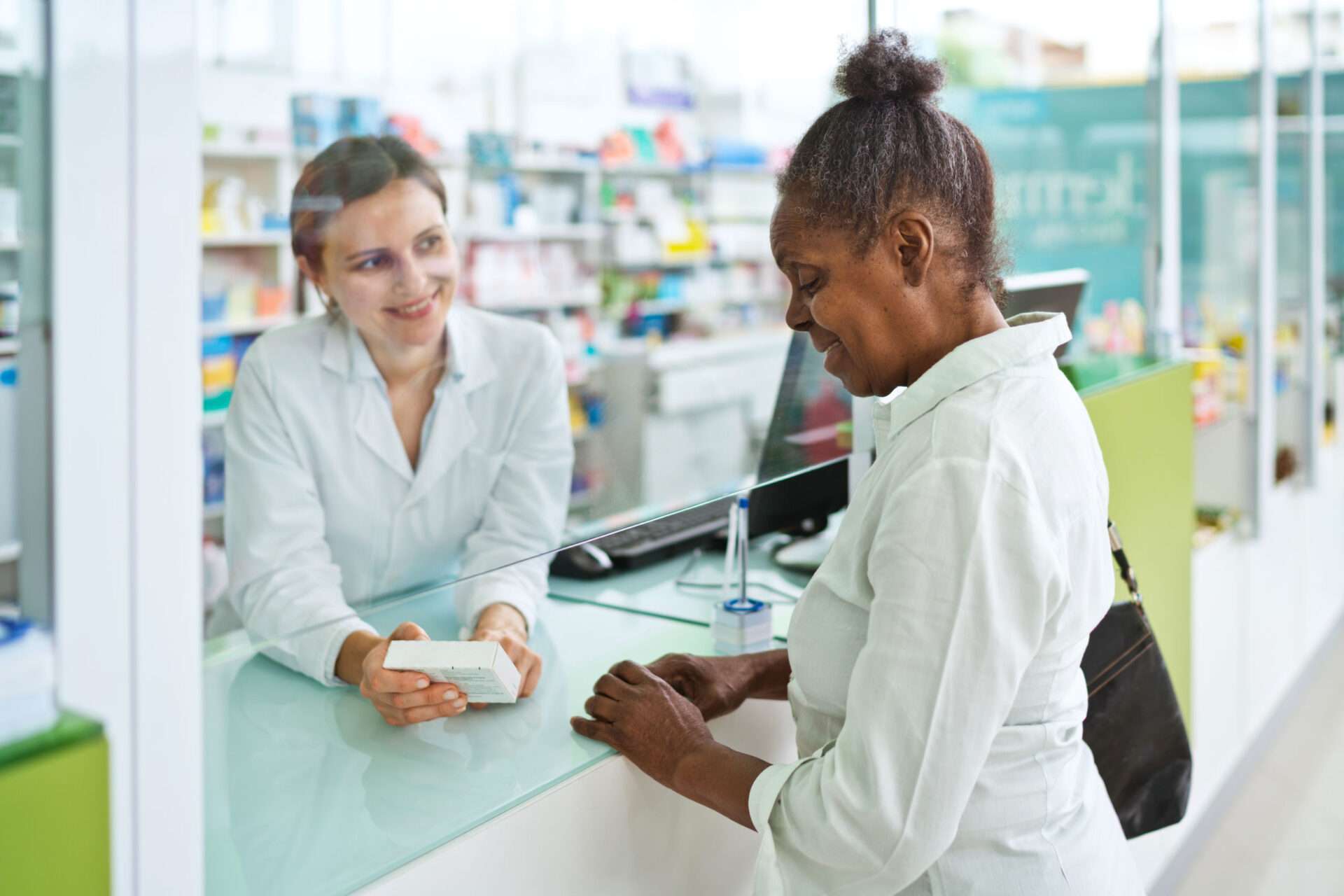 female pharmacist with customer