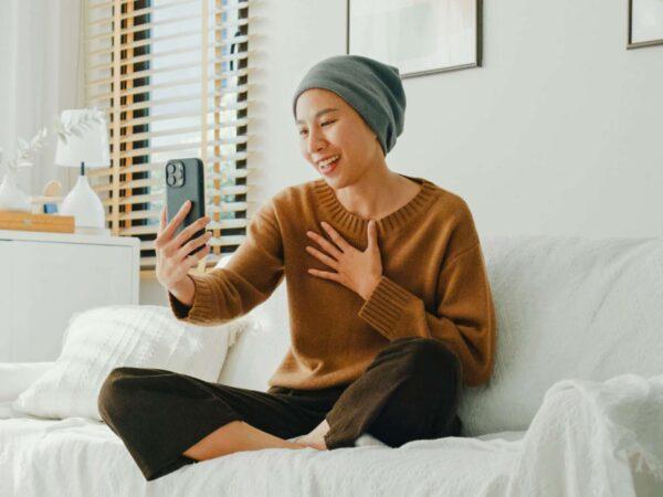 cancer patient holding phone