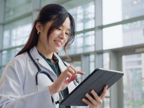 Home Doctor using tablet in hospital
